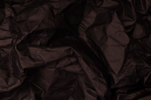 Texture or background of detailed black toned crumpled paper