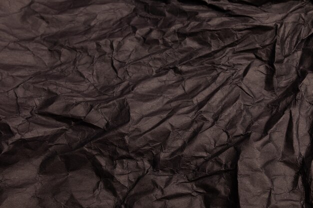 Texture or background of detailed black toned crumpled paper