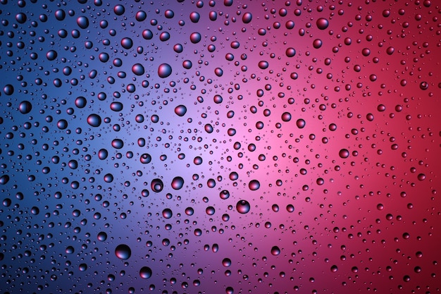 Texture and background of drops of water on a colored background