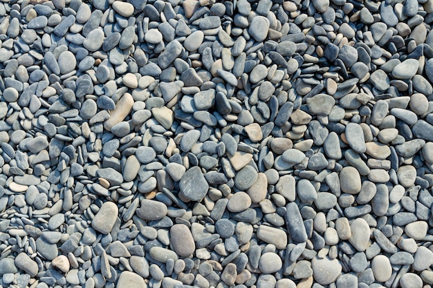 texture background made of pebbles of the coast, gray background made of canvas stones, natural back