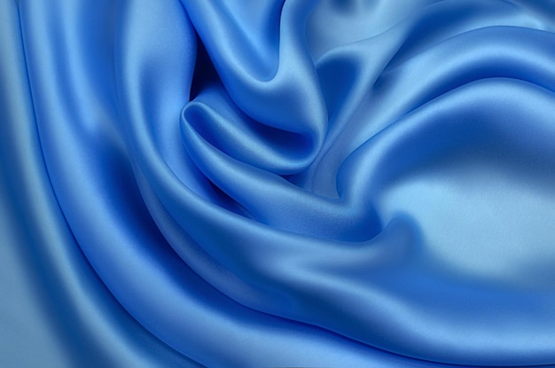 Texture, background, pattern. Texture of blue silk or cotton or wool fabric. Beautiful pattern of fabric.