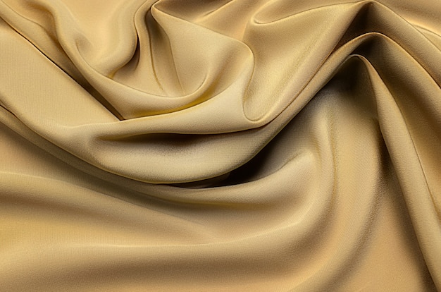 Texture background pattern Texture of yellow or golden silk or cotton or wool fabric