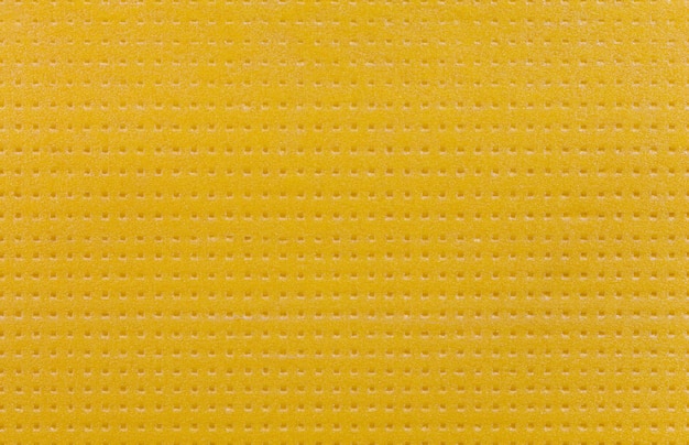 Texture and background of sheet of hard yellow styrofoam