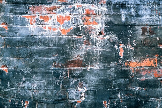 Photo texture for background of worn brick wall with dark color painted