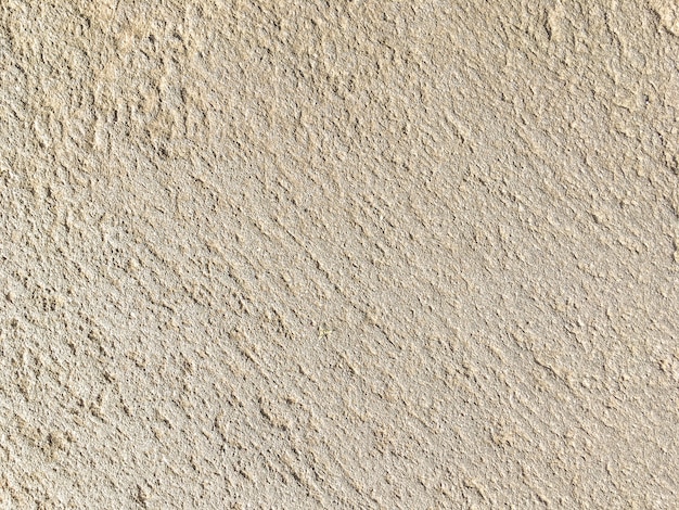 Texture of beige ancient stone, background