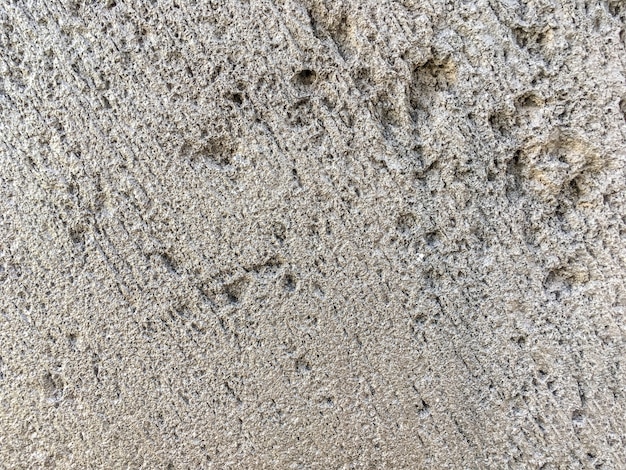 Texture of beige ancient stone, background