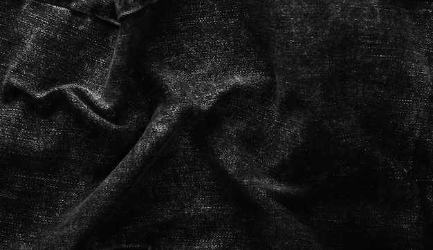 Texture of black jeans closeup. Denim background