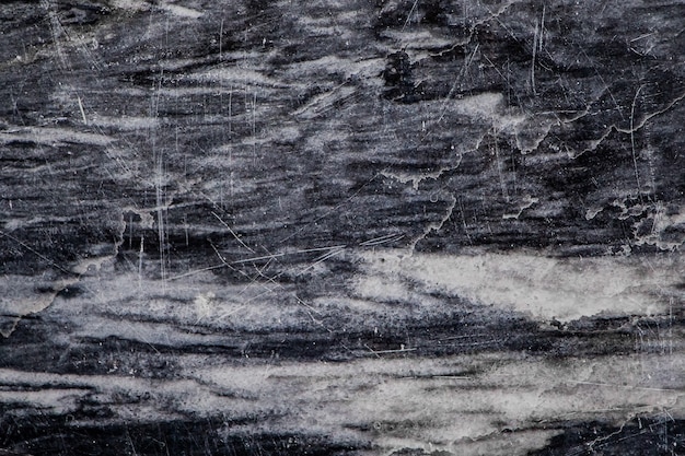 Texture of black marble with white veins closeup