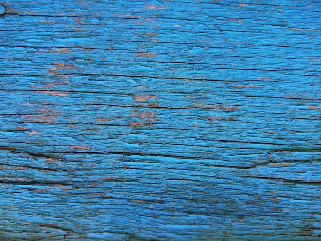 Photo texture of blue cracked wooden surface abstract background of painted wooden board