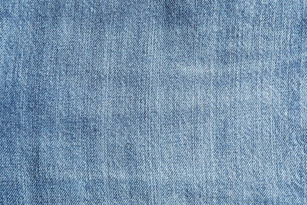 Texture of blue jeans as background, space for text