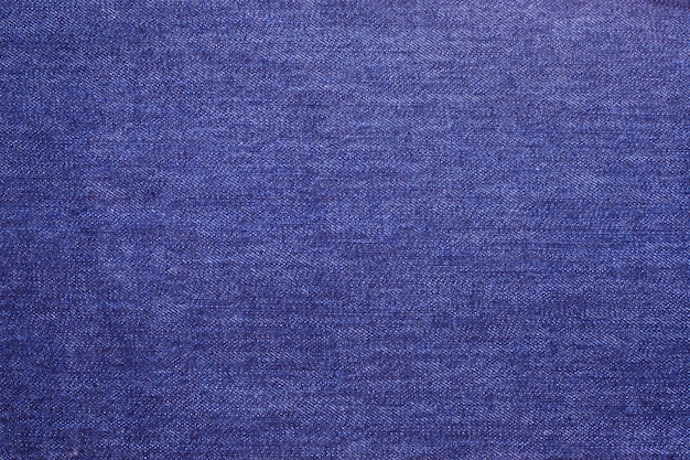 Texture of blue jeans textile close up