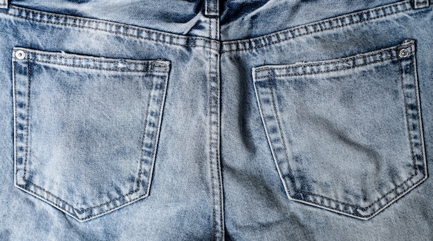 Texture of blue jeans, top view