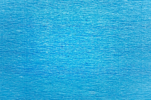 Texture of blue wrinkled corrugated paper.