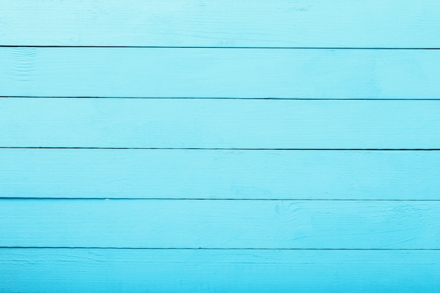 Texture of board with blue paint top view