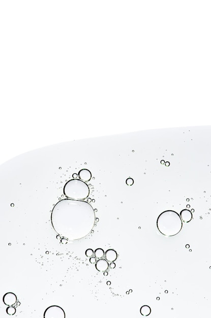 Photo the texture of a body serum or cosmetic oil with bubbles liquid skin care product copy space