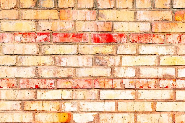 Texture, brick, wall, it can be used as a background. Brick texture with scratches and cracks