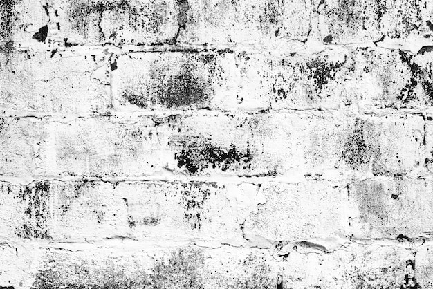 Texture of a brick wall with cracks and scratches background