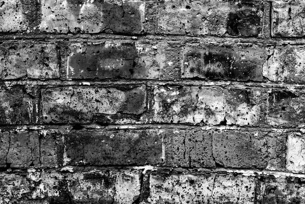 Texture of a brick wall with cracks and scratches which can be used as a background