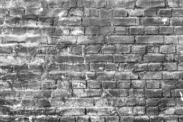 Texture of a brick wall with cracks and scratches which can be used as a background