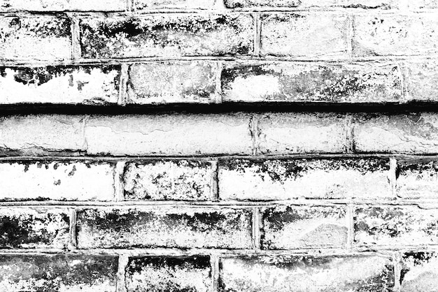 Photo texture of a brick wall with cracks and scratches which can be used as a background