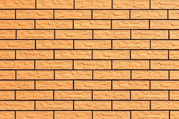 Texture of a brick wall with cracks and scratches which can be used as a background