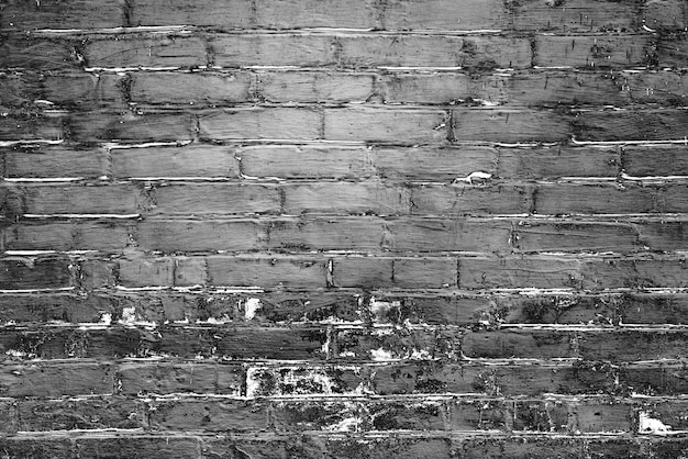 Texture of a brick wall with cracks and scratches which can be used as a background