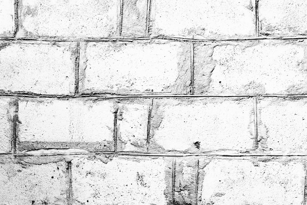 Texture of a brick wall with cracks and scratches which can be used as a background