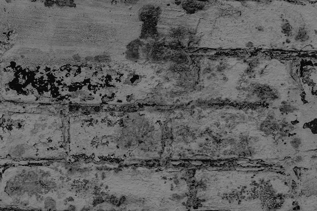 Texture of a brick wall with cracks and scratches which can be used as a background