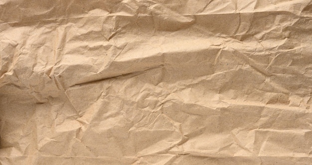 Texture of brown crumpled craft paper full frame