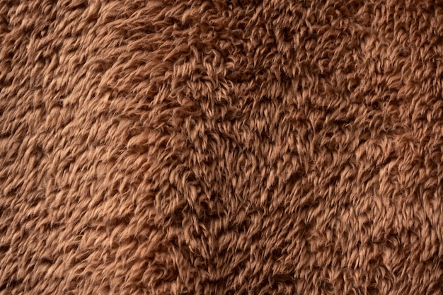 Texture of a brown faux fur as a background