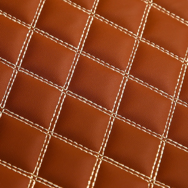 Texture of brown leather background with square pattern and stitch macro