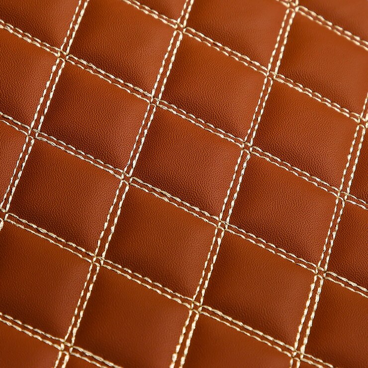 फोटो texture of brown leather background with square pattern and stitch macro