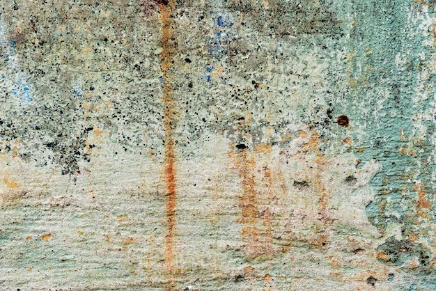 Texture of a concrete wall with cracks and scratches which can be used as a background