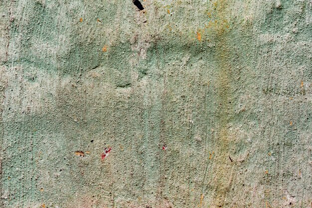 Texture of a concrete wall with cracks and scratches which can be used as a background