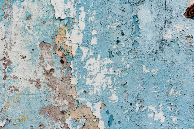 Photo texture of a concrete wall with cracks and scratches which can be used as a background