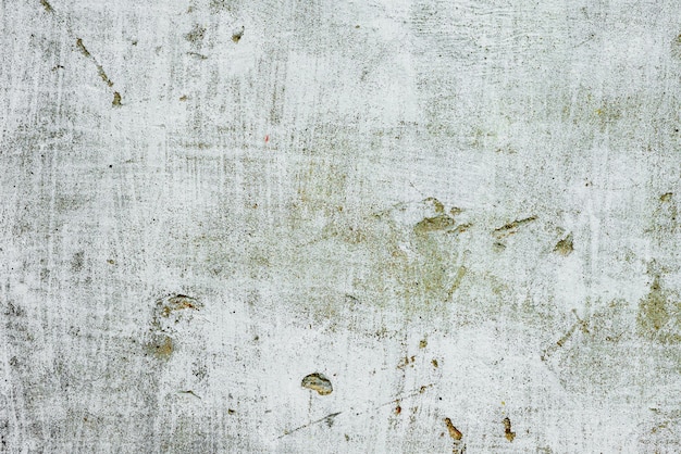 Texture of a concrete wall with cracks and scratches which can be used as a background