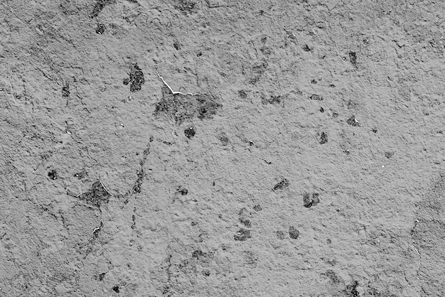 Texture of a concrete wall with cracks and scratches which can be used as a background