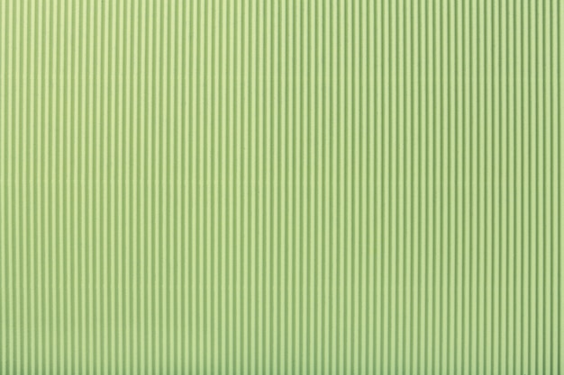 Texture of corrugated light green paper, macro,