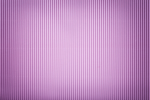 Texture of corrugated lilac paper with vignette