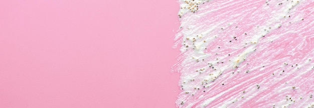 The texture of a cosmetic scrub An exfoliating skin care product Pink background Copy space