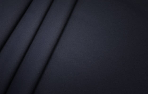 The texture of the cotton fabric with dark gray wool. 