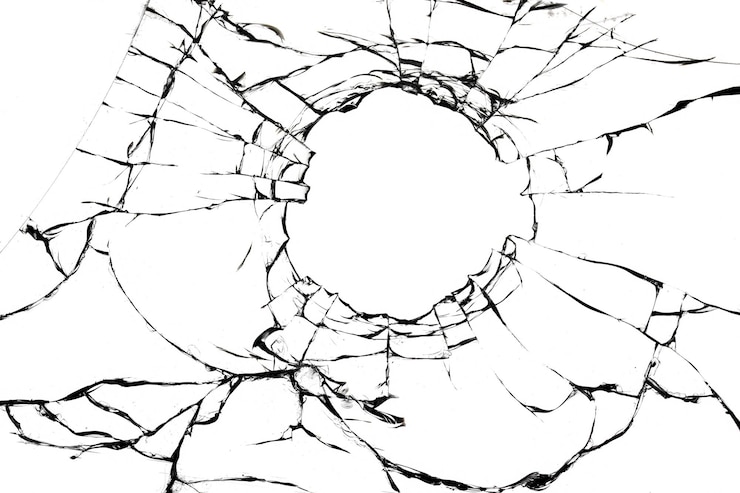 Photo texture of cracks of broken glass on a white background broken window effect for design