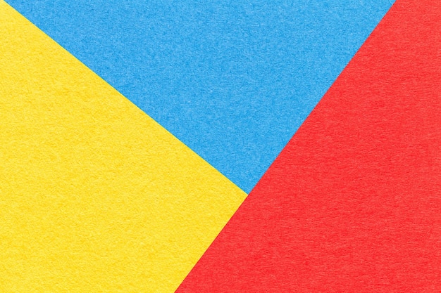 クラフト青赤と黄色の色合いの紙の背景マクロのテクスチャヴィンテージ抽象板紙の構造