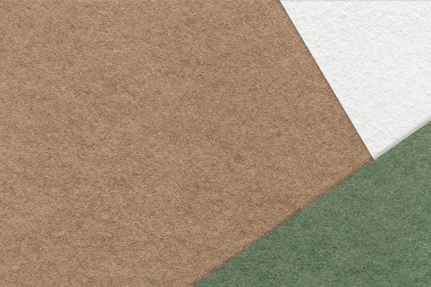 Photo texture of craft brown color paper background with white and green border vintage abstract cardboard