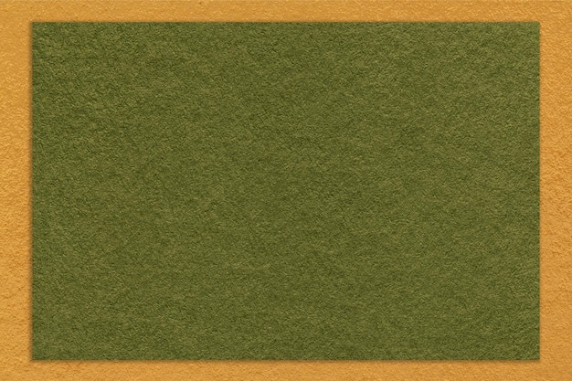 Texture of craft dark green color paper background with yellow border macro Vintage kraft olive cardboard