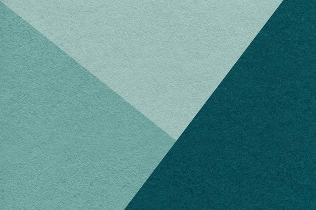 Texture of craft emerald and cyan shade color paper background macro Vntage abstract green cardboard