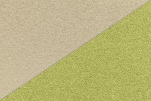 Texture of craft light beige and green paper background half two colors Vintage kraft olive cardboard