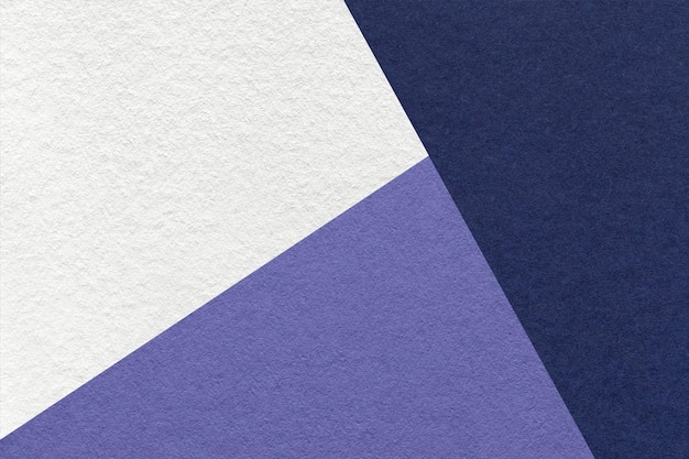Photo texture of craft navy blue white and violet shade color paper background macro vintage abstract indigo cardboard