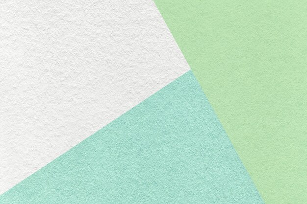 Photo texture of craft white green and cyan shade paper background macro vintage abstract pastel cardboard