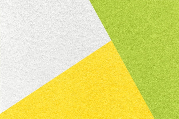 Texture of craft white green and yellow shade color paper background macro Structure of vintage abstract cardboard